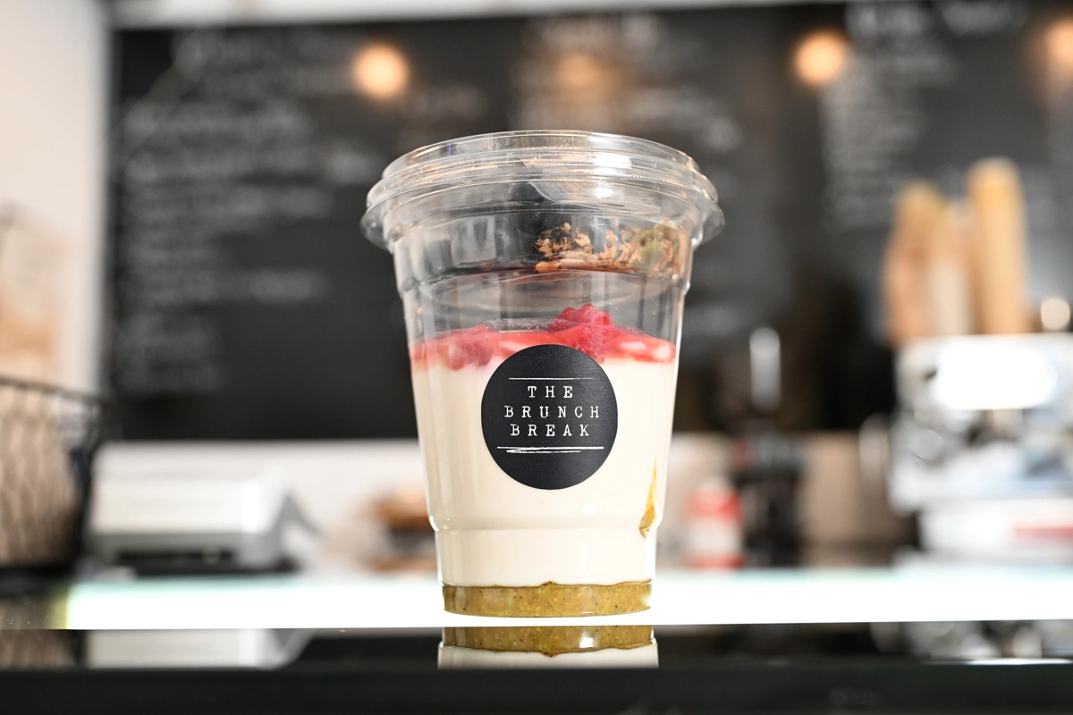 The Brunch Break yogurt bowl with granola and raspberries