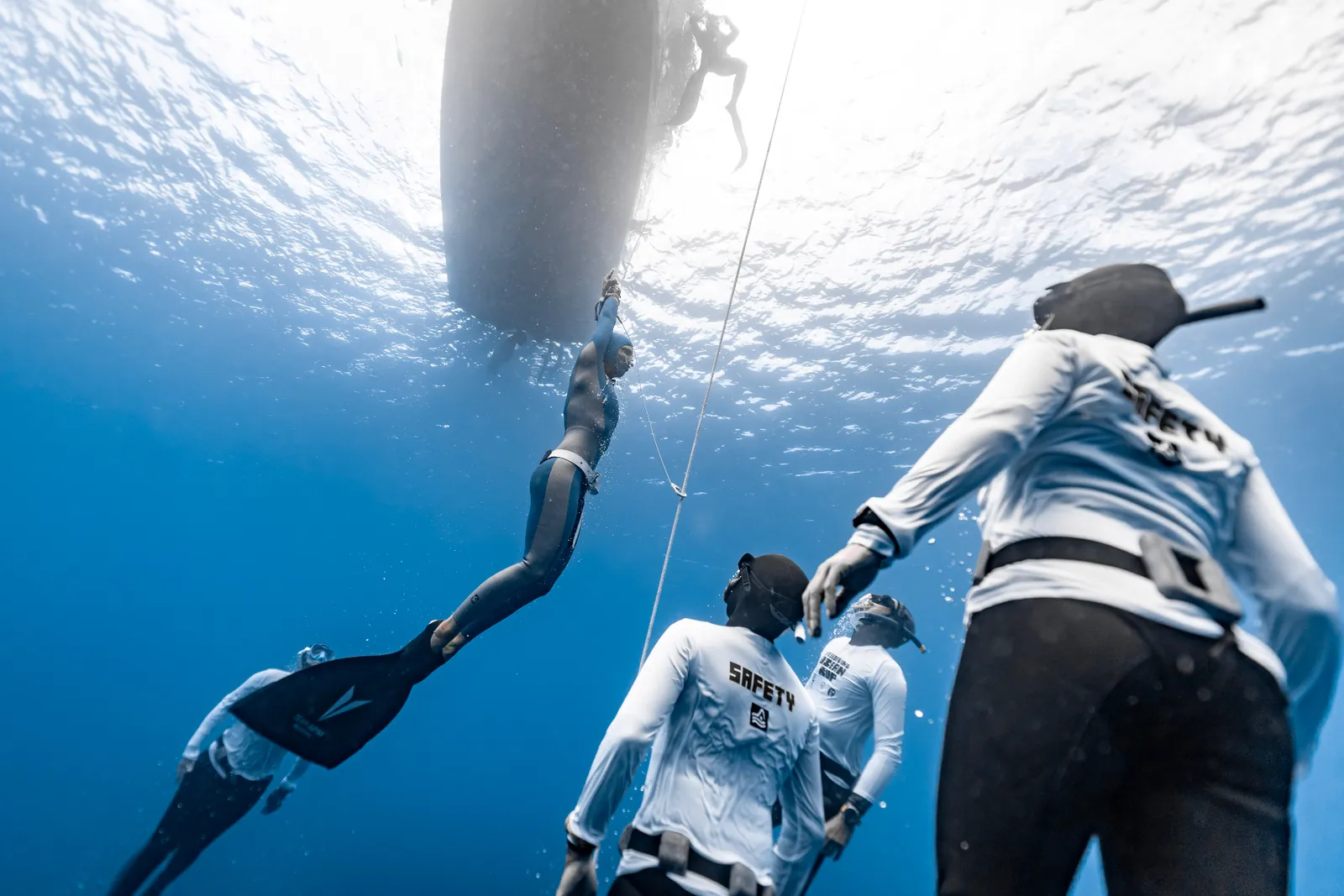 Freediver descending the rope in Lanzarote's crystal-clear waters