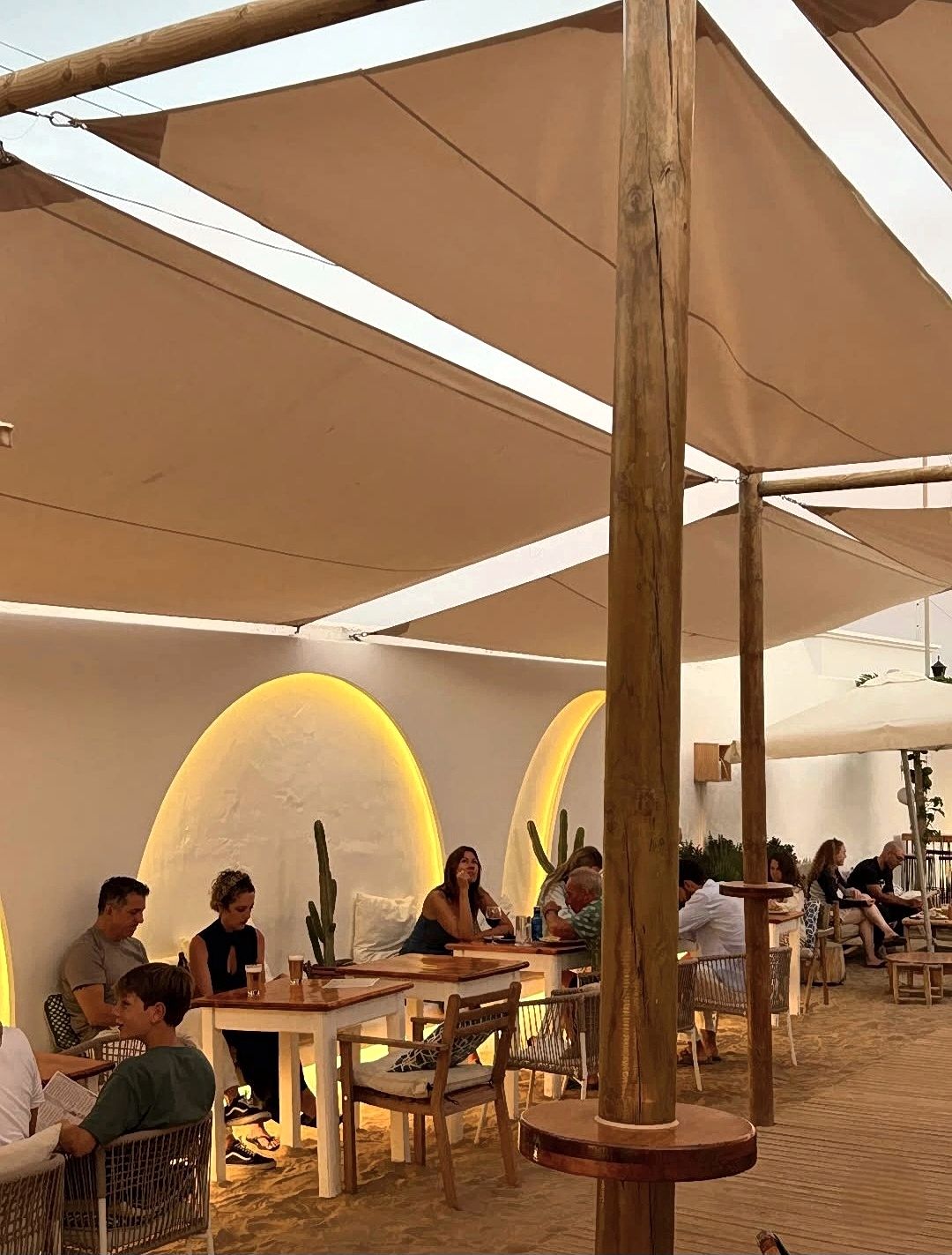 Munsoo Slow Food terrace with sand floor and canvas shade