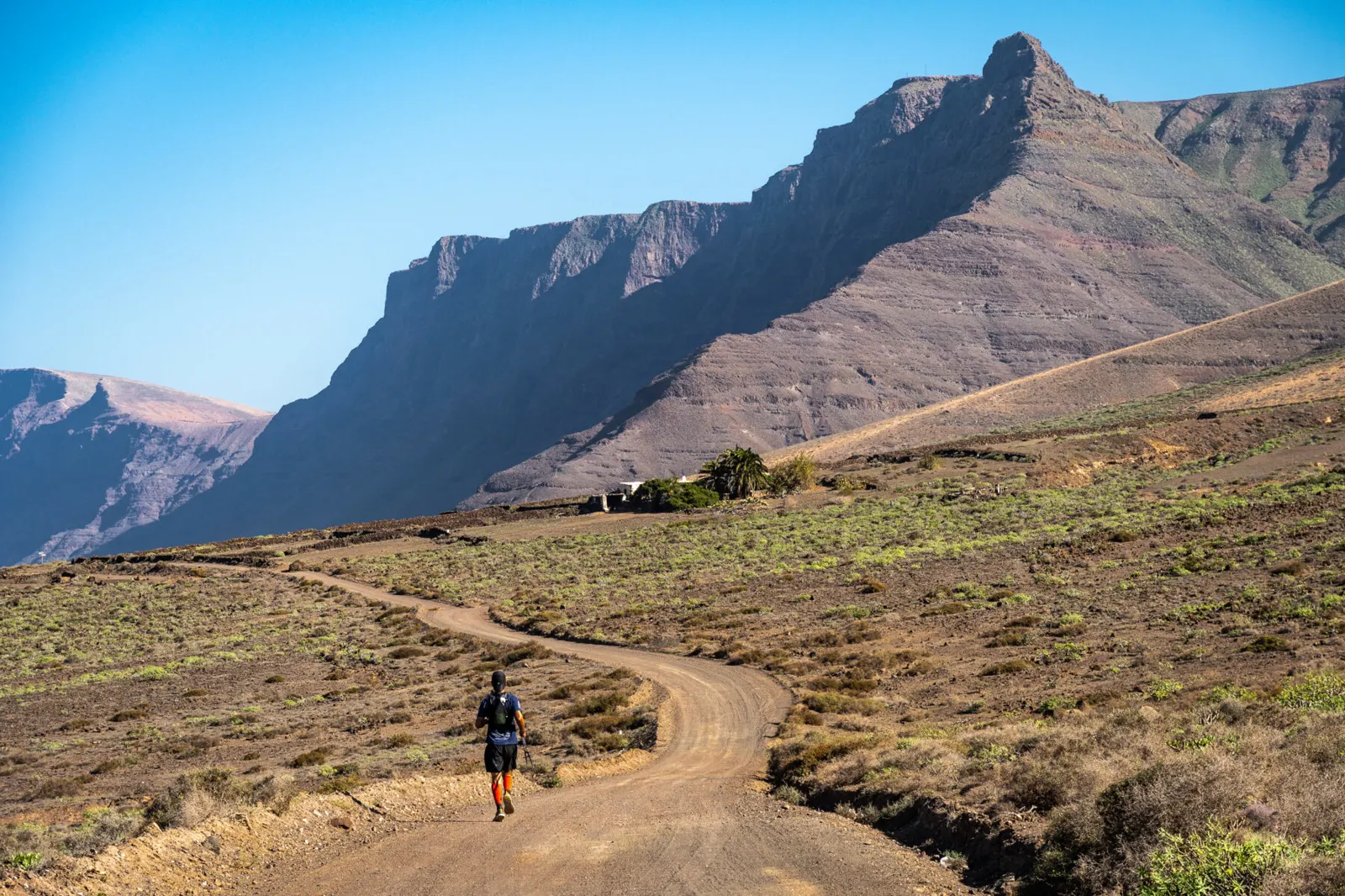 Trail running by the Risco de Famara